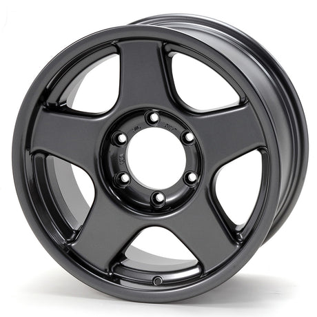 Black alloy wheel on a white background