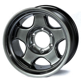 Metallic gray alloy wheel on a white background