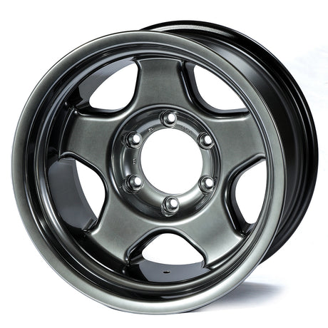 Metallic gray alloy wheel on a white background