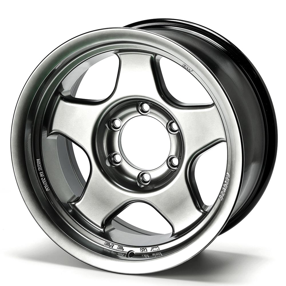 Chrome car wheel rim on a white background
