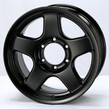 Black alloy wheel on a white background