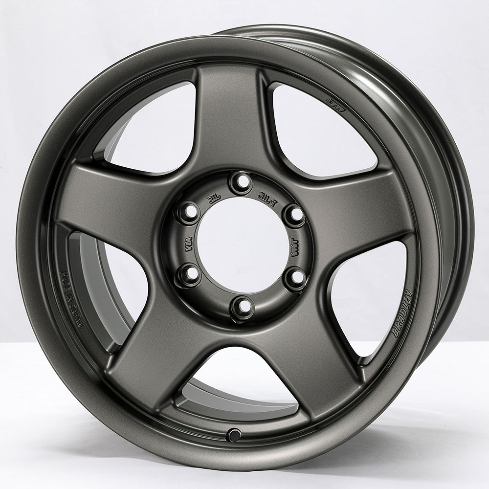 Gray alloy wheel on a white background
