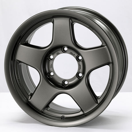Gray alloy wheel on a white background