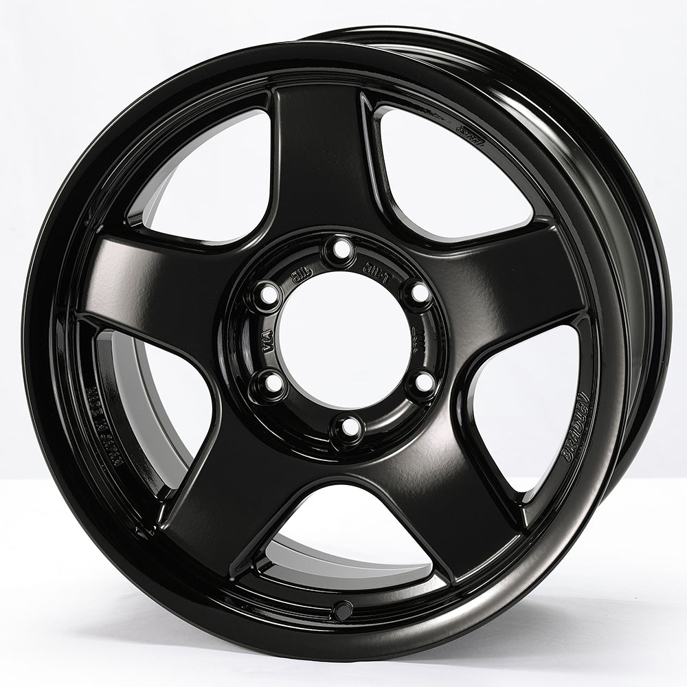 Black alloy wheel on a white background
