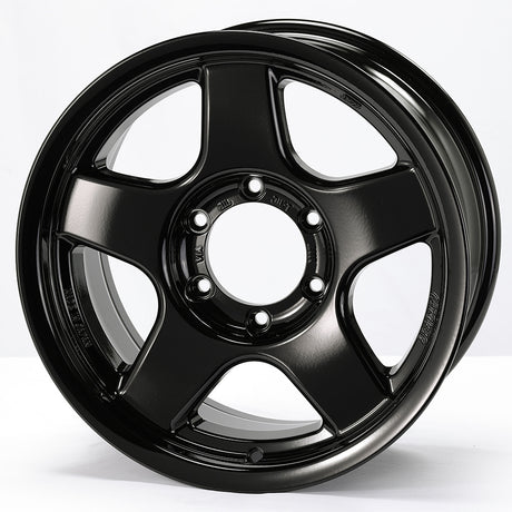 Black alloy wheel on a white background