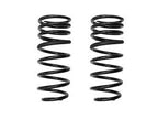 A pair of black rear coil springs for a vehicle.