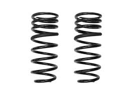 A pair of black rear coil springs for a vehicle.