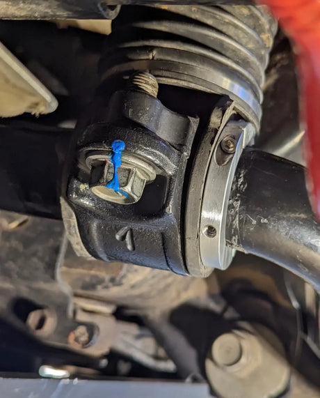 Close-up of a mechanical component , likely part of a vehicle's suspension system.