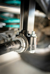 Close-up of a mechanical component with bolts and metal parts.