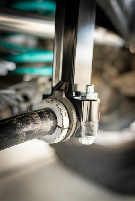 Close-up of a mechanical component with bolts and metal parts.