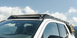 Angled view of roof rack on an SUV with a lightbar attached to it