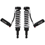 Two shock absorbers with springs on a white background