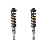 Black, silver and yellow OME coilovers on a white background