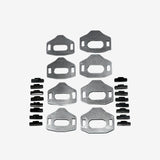 Set of metal brackets and fasteners on a gray background