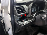 Car interior with open glove compartment showing wiring and components.