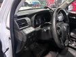 Car interior with steering wheel and dashboard view