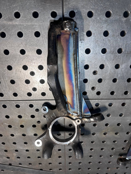 Metal mechanical part on a pegboard