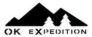 Logo of OK Expedition with mountains and trees design.