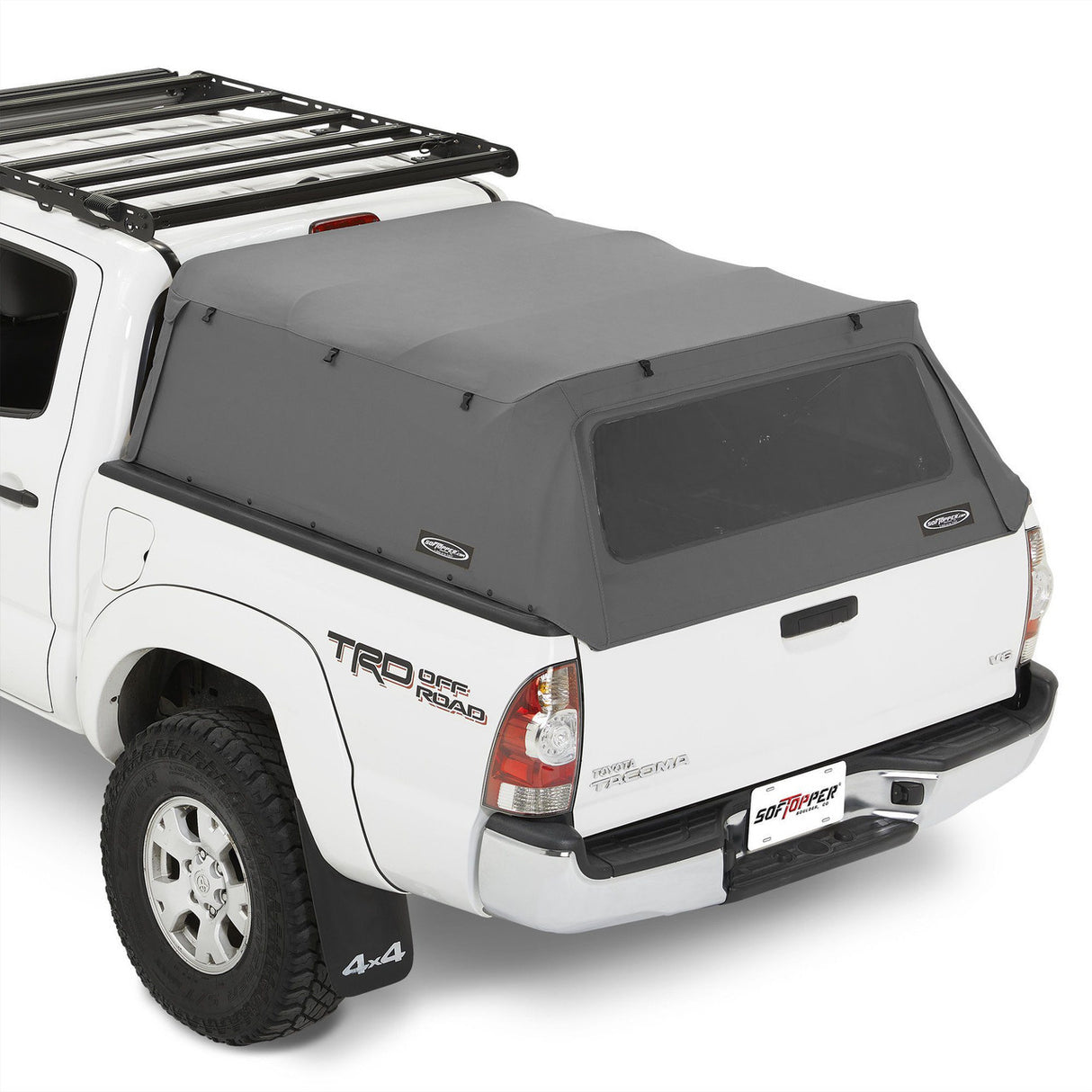 White truck with a black roof rack and gray tonneau cover on a white background