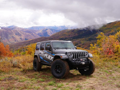 Jeep on off road trail with mountains in the background