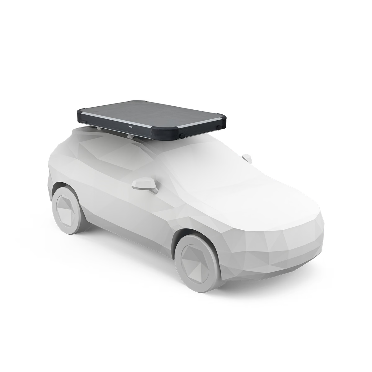White car with a black roof box on a white background
